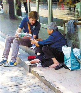 young-man-helping-a-homeless-man